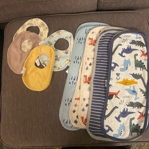 Baby boy nest bibs and Gerber burp cloths. 4 bibs and 8 burp cloths